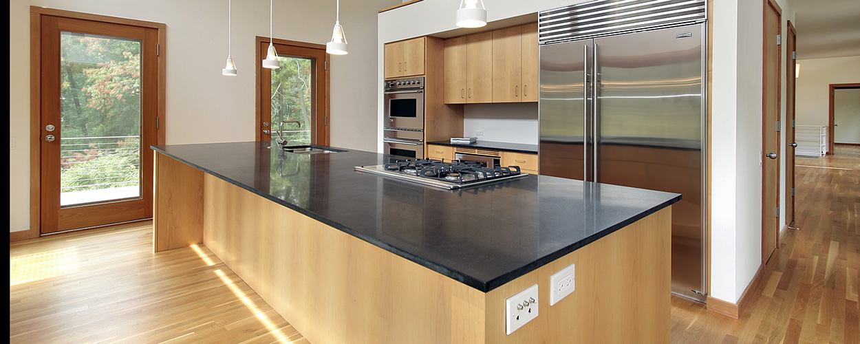 kitchen with black granite countertop